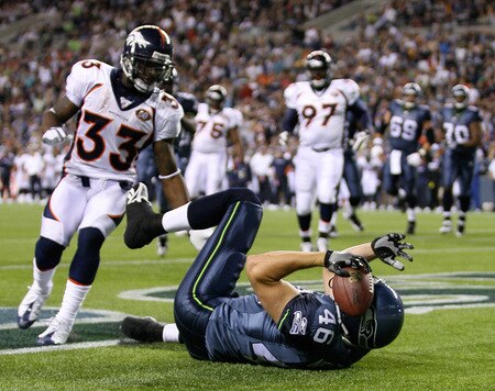 SEATTLE - AUGUST 22:  Tight end Joe Newton #46 of the Seattle Seahawks makes a touchdown catch in the endzone against Alphonso Smith #33 of the Denver Broncos on August 22, 2009 at Qwest Field in Seattle, Washington. The Seahawks defeated the Broncos 27-13.  <br /><br /><span class="help">(Photo by Otto Greule Jr/Getty Images)</span>