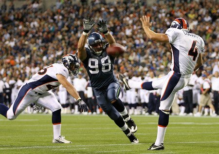 SEATTLE - AUGUST 22:  Defensive end Nick Reed #98 of the Seattle Seahawks just misses blocking a punt by Britton Colquitt #4 of the Denver Broncos on August 22, 2009 at Qwest Field in Seattle, Washington. The Seahawks defeated the Broncos 27-13. <br /><br /><span class="help">(Photo by Otto Greule Jr/Getty Images)</span>