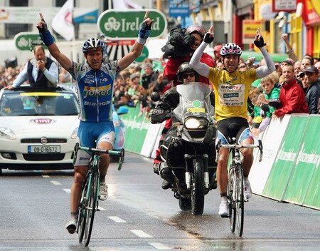 CORK, IRELAND - AUGUST 23:  Stage Three winner Lars Petter Nordhaug of Norway and Joker Bianchi team (L) and overall race winner Russell Downing of Great Britain and CandiTV - Pinarello team cross the finish line of Stage Three of the 2009 Tour of Ireland from Bantry to Cork on August 23, 2009 in Cork, Ireland.  <br /><br /><span class="help">(Photo by Bryn Lennon/Getty Images)</span>
