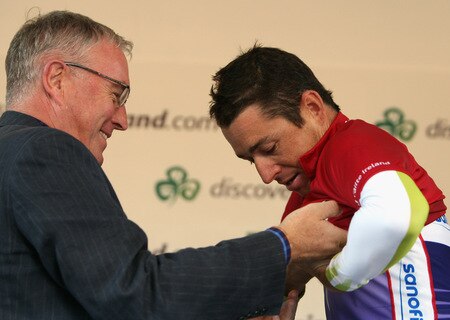 CORK, IRELAND - AUGUST 23: UCI President Pat McQuaid presents Matt Wilson of Australia and Team Type 1 with his King of the Mountains Jersey after Stage Three from Bantry to Cork on August 23, 2009 in Cork, Ireland.  <br /><br /><span class="help">(Photo by Bryn Lennon/Getty Images).</span>