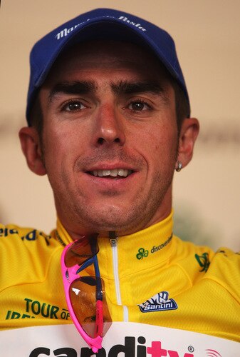 CORK, IRELAND - AUGUST 23:  Russell Downing of Great Britain and Candi TV pulls on the yellow jersey after winning the 2009 Tour of Ireland Stage Three from Bantry to Cork on August 23, 2009 in Cork, Ireland.  <br /><br /><span class="help">(Photo by Bryn Lennon/Getty Images).</span>