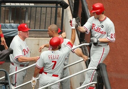 NEW YORK - AUGUST 23:  Jayson Werth #28 of the Philadelphia Phillies celebrates with Pedro Feliz #7 and manager Charlie Manuel after Werth hit a 3-run home run in the top of the first inning against the New York Mets on August 23, 2009 at Citi Field in the Flushing neighborhood of the Queens borough of New York City.  <br /><br /><span class="help">(Photo by Al Bello/Getty Images)</span>