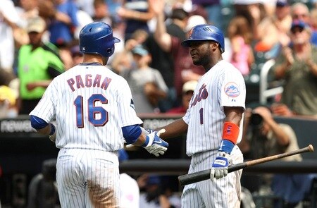 NEW YORK - AUGUST 23:  Luis Castillo #1 (R) and Angel Pagan #16 of the New York Mets celebrate after Pagan scored on a solo home run in the bottom of the third inning against the Philadelphia Phillies on August 23, 2009 at Citi Field in the Flushing neighborhood of the Queens borough of New York City.  <br /><br /><span class="help">(Photo by Al Bello/Getty Images)</span>