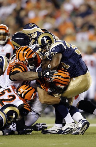 CINCINNATI, OH - AUGUST 27:  Running back Kenneth Darby #34 of the St. Louis Rams runs into a pile of Cincinnati Bengals defenders during the preseason game at Paul Brown Stadium on August 27, 2009 in Cincinnati, Ohio. <br /><br /><span class="help">(Photo by Andy Lyons/Getty Images)</span>