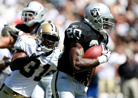 OAKLAND, CA - AUGUST 29:  Running back Darren McFadden #20 of the Oakland Raiders runs the ball against Pierson Prioleau #31 of the New Orleans Saints during the preseason game at Oakland-Alameda County Coliseum on August 29, 2009 in Oakland, California. <br /><br /><span class="help">(Photo by Jed Jacobsohn/Getty Images)</span>