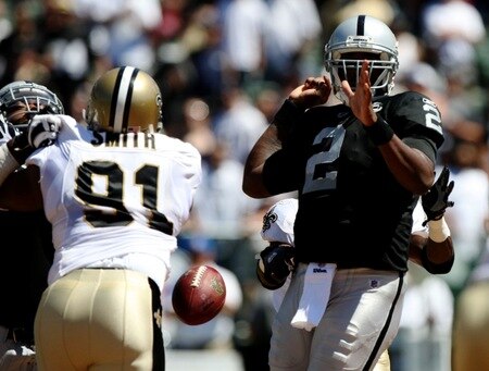 OAKLAND, CA - AUGUST 29:  Quarterback JaMarcus Russell #2 of the Oakland Raiders has the ball knocked loose by a New Orleans Saints defender during the preseason game at Oakland-Alameda County Coliseum on August 29, 2009 in Oakland, California. <br /><br /><span class="help">(Photo by Jed Jacobsohn/Getty Images)</span>