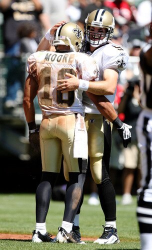 OAKLAND, CA - AUGUST 29:  Quarterback Drew Brees#3 and wide receiver Lance Moore #16 of the New Orleans Saints celebrate a touchdown during the preseason game against the Oakland Raiders at Oakland-Alameda County Coliseum on August 29, 2009 in Oakland, California. <br /><br /><span class="help">(Photo by Jed Jacobsohn/Getty Images)</span>