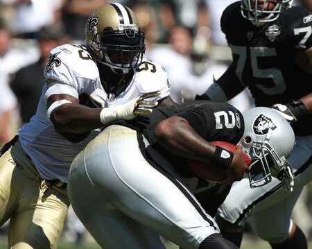 OAKLAND, CA - AUGUST 29:  Quarterback JaMarcus Russell #2 of the Oakland Raiders is sacked by Bobby McCray #93 of the New Orleans Saints during an NFL preseason game at Oakland-Alameda County Coliseum on August 29, 2009 in Oakland, California.  <br /><br /><span class="help">(Photo by Jed Jacobsohn/Getty Images)</span>
