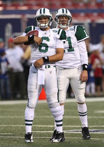 EAST RUTHERFORD, NJ - AUGUST 29:  Starting quarterback Mark Sanchez #6 and back-up quarterback Kellen Clemens #11 of the New York Jets take the field for warm-ups prior to the preseason game against the New York Giants at Giants Stadium on August 29, 2009 in East Rutherford, New Jersey.  <br /><br /><span class="help">(Photo by Jim McIsaac/Getty Images)</span>