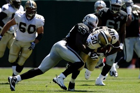OAKLAND, CA - AUGUST 29:  Linebacker Thomas Howard #53 of the Oakland Raiders tackles Lynell Hamilton #30 of the New Orleans Saints during the preseason game at Oakland-Alameda County Coliseum on August 29, 2009 in Oakland, California. <br /><br /><span class="help">(Photo by Jed Jacobsohn/Getty Images)</span>