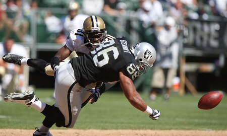 OAKLAND, CA - AUGUST 29:  Tony Stewart #86 of the Oakland Raiders is hit after a catch by Pierson Prioleau #31 of the New Orleans Saints during an NFL preseason game at Oakland-Alameda County Coliseum on August 29, 2009 in Oakland, California.  <br /><br /><span class="help">(Photo by Jed Jacobsohn/Getty Images)</span>