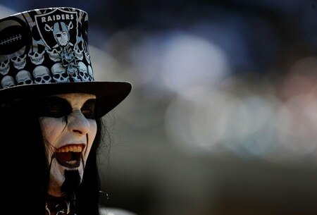 OAKLAND, CA - AUGUST 29:  A fan of the Oakland Raiders watches the preseason game against the New Orleans Saints at Oakland-Alameda County Coliseum on August 29, 2009 in Oakland, California. <br /><br /><span class="help">(Photo by Jed Jacobsohn/Getty Images)</span>