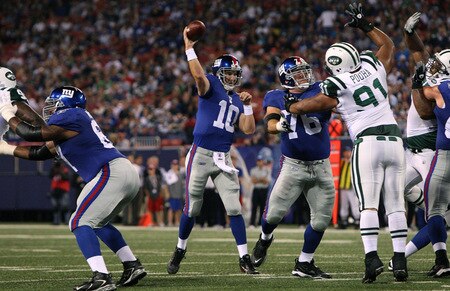 EAST RUTHERFORD, NJ - AUGUST 29:  Quarterback Eli Manning #10 of the New York Giants throws a pass for a touch down in the first quarter against the New York Jets aduring a preseason game Giants Stadium on August 29, 2009 in East Rutherford, New Jersey.  <br /><br /><span class="help">(Photo by Jim McIsaac/Getty Images)</span>