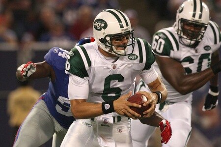 EAST RUTHERFORD, NJ - AUGUST 29:  Quarterback Mark Sanchez #6 of the New York Jets trruns while under pressure from the New York Giants defense during a preseason game at Giants Stadium on August 29, 2009 in East Rutherford, New Jersey.  <br /><br /><span class="help">(Photo by Jim McIsaac/Getty Images)</span>