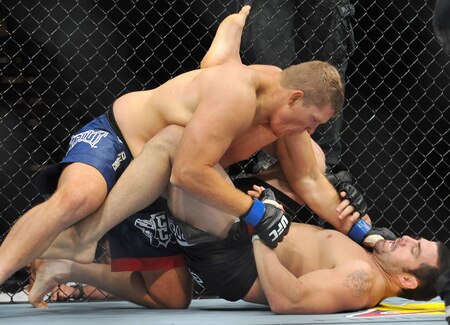 PORTLAND, OR - AUGUST 29:  UFC fighter Mike Russow (L) battles UFC fighter Justin McCully (R) during their Heavyweight bout at UFC 102:  Couture vs. Nogueira at the Rose Garden Arena on August 29, 2009 in Portland, Oregon.  <br /><br /><span class="help">(Photo by Jon Kopaloff/Getty Images)</span>
