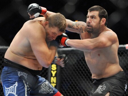 PORTLAND, OR - AUGUST 29:  UFC fighter Mike Russow (L) battles UFC fighter Justin McCully (R) during their Heavyweight bout at UFC 102:  Couture vs. Nogueira at the Rose Garden Arena on August 29, 2009 in Portland, Oregon.  <br /><br /><span class="help">(Photo by Jon Kopaloff/Getty Images)</span>