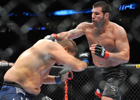 PORTLAND, OR - AUGUST 29:  UFC fighter Mike Russow (L) battles UFC fighter Justin McCully (R) during their Heavyweight bout at UFC 102:  Couture vs. Nogueira at the Rose Garden Arena on August 29, 2009 in Portland, Oregon.  <br /><br /><span class="help">(Photo by Jon Kopaloff/Getty Images)</span>