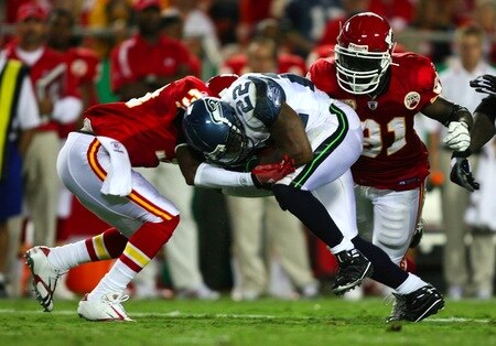 KANSAS CITY, MO - AUGUST 29: Running back Julius Jones #22 of the Seattle Seahawks runs the ball against Maurice Leggett #31 (L) and Tamba Hali #91 of the Kansas City Chiefs during their preseason game at Arrowhead Stadium on August 29, 2009 in Kansas City, Missouri. <br /><br /><span class="help">(Photo by Dilip Vishwanat/Getty Images)</span>