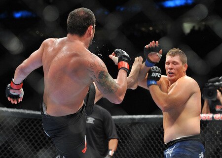 PORTLAND, OR - AUGUST 29:  UFC fighter Mike Russow (R) battles UFC fighter Justin McCully (L) during their Heavyweight bout at UFC 102:  Couture vs. Nogueira at the Rose Garden Arena on August 29, 2009 in Portland, Oregon.  <br /><br /><span class="help">(Photo by Jon Kopaloff/Getty Images)</span>
