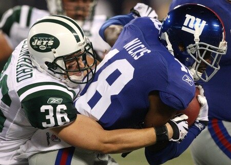 EAST RUTHERFORD, NJ - AUGUST 29:  Safety Jim Leonhard #36 of the New York Jets tackles wide receiver Hakeem Nicks #18 of the New York Giants during the preseason game at Giants Stadium on August 29, 2009 in East Rutherford, New Jersey.  <br /><br /><span class="help">(Photo by Jim McIsaac/Getty Images)</span>