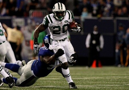 EAST RUTHERFORD, NJ - AUGUST 29: Thomas Jones #20 of the New York Jets gets tackled by defensive tackle Barry Cofield #96 of the New York Giants during the preseason game at Giants Stadium on August 29, 2009 in East Rutherford, New Jersey.  <br /><br /><span class="help">(Photo by Jim McIsaac/Getty Image</span>