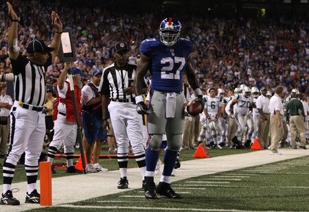 EAST RUTHERFORD, NJ - AUGUST 29:  Running back Brandon Jacobs #27 of the New York Giants celebrates after rushing for a touch down in the first quarter against the New York Jets during the preseason game at Giants Stadium on August 29, 2009 in East Rutherford, New Jersey.  <br /><br /><span class="help">(Photo by Jim McIsaac/Getty Images)</span>