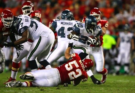 KANSAS CITY, MO - AUGUST 29: Running back Justin Forsett #20 of the Seattle Seahawks runs the ball against Monty Beisel #52 of the Kansas City Chiefs during their preseason game at Arrowhead Stadium on August 29, 2009 in Kansas City, Missouri. <br /><br /><span class="help">(Photo by Dilip Vishwanat/Getty Images)</span>