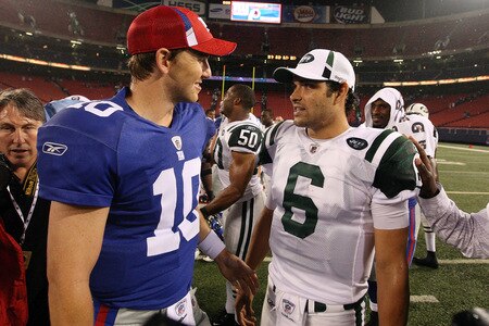 EAST RUTHERFORD, NJ - AUGUST 29:  Eli Manning #10 of the New York Giants talks with Mark Sanchez #6 of the New York Jets after their game on August 29, 2009 at Giants Stadium in East Rutherford, New Jersey.  <br /><br /><span class="help">(Photo by Jim McIsaac/Getty Images)</span>