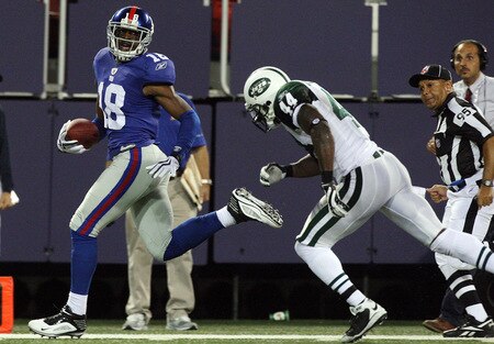 EAST RUTHERFORD, NJ - AUGUST 29:  Hakeem Nicks #18 of the New York Giants runs a reception past James Ihedigbo #44 of the New York Jets for a fourth quarter touchdown on August 29, 2009 at Giants Stadium in East Rutherford, New Jersey.  <br /><br /><span class="help">(Photo by Jim McIsaac/Getty Images)</span>