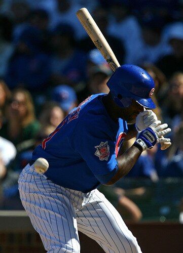 CHICAGO - AUGUST 30: Milton Bradley #21 of the Chicago Cubs is hit by a pitch from Nelson Figueroa of the New York Mets in the 5th inning on August 30, 2009 at Wrigley Field in Chicago, Illinois. <br /><br /><span class="help">(Photo by Jonathan Daniel/Getty Images)</span>