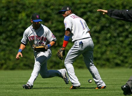 CHICAGO - AUGUST 30: A ball hit by Derrek Lee of the Chicago Cubs falls between Angel Pagan #16 and Luis Castillo #1 of the New York Mets for a hit on August 30, 2009 at Wrigley Field in Chicago, Illinois. <br /><br /><span class="help">(Photo by Jonathan Daniel/Getty Images)</span>