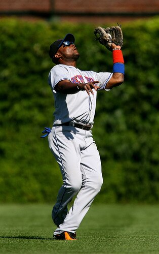 CHICAGO - AUGUST 30: Luis Castillo #1 of the New York Mets catches a wind-blown fly ball against the Chicago Cubs on August 30, 2009 at Wrigley Field in Chicago, Illinois. The Mets defeated the Cubs 4-1. <br /><br /><span class="help">(Photo by Jonathan Daniel/Getty Images)</span>