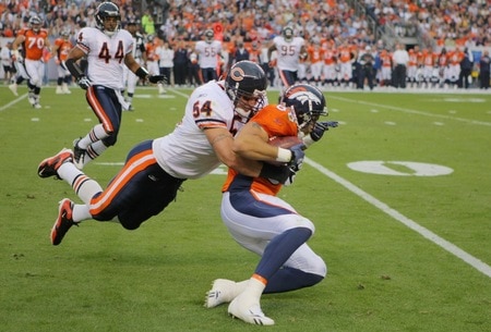 DENVER - AUGUST 30:  Linebacker Brian Urlacher #54 of the Chicago Bears tackles tight end Tony Scheffler #88 of the Denver Broncos during the second quarter at INVESCO Field at Mile High on August 30, 2009 in Denver, Colorado.  <br /><br /><span class="help">(Photo by Doug Pensinger/Getty Images)</span>