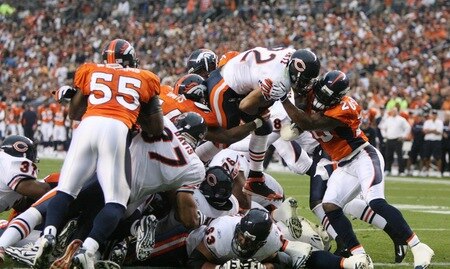 DENVER - AUGUST 30:  Running back Matt Forte #22 of the Chicago Bears goes up the middle for a one yard touchdown against Brian Dawkins #20 of the Denver Broncos during the second quarter at INVESCO Field at Mile High on August 30, 2009 in Denver, Colorado.  <br /><br /><span class="help">(Photo by Doug Pensinger/Getty Images)</span>