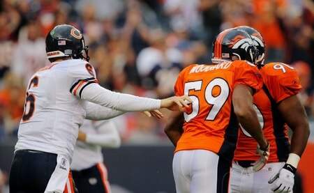 DENVER - AUGUST 30:  Quarterback Jay Cutler #6 of the Chicago Bears pushes Wesley Woodyard #59 of the Denver Broncos after an incomplete pass during the first quarter at INVESCO Field at Mile High on August 30, 2009 in Denver, Colorado.  <br /><br /><span class="help">(Photo by Doug Pensinger/Getty Images)</span>