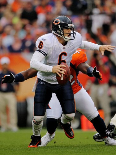 DENVER - AUGUST 30:  Quarterback Jay Cutler #6 of the Chicago Bears looks to get rid of the ball while under pressure from Elvis Dumervil #92 of the Denver Broncos during the first quarter at INVESCO Field at Mile High on August 30, 2009 in Denver, Colorado.  <br /><br /><span class="help">(Photo by Doug Pensinger/Getty Images)</span>