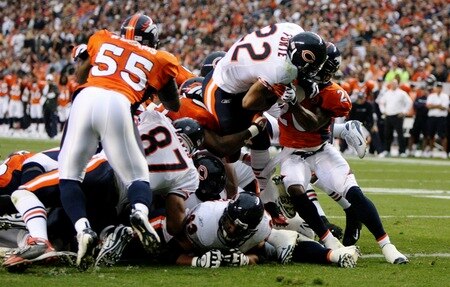 DENVER - AUGUST 30:  Running back Matt Forte #22 of the Chicago Bears goes up the middle for a one yard touchdown against Brian Dawkins #20 of the Denver Broncos during the second quarter at INVESCO Field at Mile High on August 30, 2009 in Denver, Colorado.  <br /><br /><span class="help">(Photo by Doug Pensinger/Getty Images)</span>