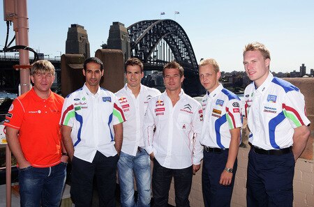 SYDNEY, AUSTRALIA - AUGUST 31:  (L- R) Henning Solberg of Norway and the Stobart VK M-Sport Ford Rally team, Sheikh Khalid Al Qassimi of the UAE and the BP Ford Abu Dhabi World Rally team, Dani Sordo of Spain and Sebastien Loeb of France and the Citroen Total World Rally team, Mikko Hirvonen of Finland and Jari-Matti Latvala of Finland and the BP Ford Abu Dhabi World Rally team pose in front of the Sydney Harbour Bridge during a Rally Australia press conference at The Rocks on August 31, 2009 in Sydney, Australia.  <br /><br /><span class="help">(Photo by Matt King/Getty Images)</span>