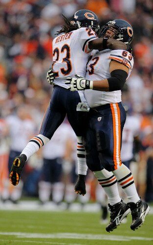 DENVER - AUGUST 30:  Wide receiver Devin Hester #23 (L) of the Chicago Bears celebrates with teammate Roberto Garza #63 during the second quarter against the Denver Broncos at INVESCO Field at Mile High on August 30, 2009 in Denver, Colorado.  <br /><br /><span class="help">(Photo by Doug Pensinger/Getty Images)</span>