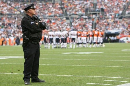 DENVER - AUGUST 30:  A police officer stands on the field during a break from the preseason game between the Chicago Bears and the Denver Broncos at INVESCO Field at Mile High on August 30, 2009 in Denver, Colorado.  <br /><br /><span class="help">(Photo by Doug Pensinger/Getty Images)</span>