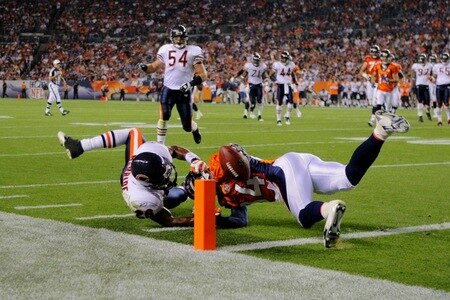 DENVER - AUGUST 30:  Wide receiver Brandon Lloyd #84 of the Denver Broncos catches a 16 yard pass against Trumaine McBride #26 of the Chicago Bears during the third quarter at INVESCO Field at Mile High on August 30, 2009 in Denver, Colorado.  <br /><br /><span class="help">(Photo by Doug Pensinger/Getty Images)</span>