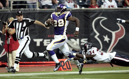 HOUSTON - AUGUST 31:  Running back Adrian Peterson #28 scores on a 75 yard run as strong safety Dominique Barber #34 of the Houston Texans makes a diving attempt to make the tackle at Reliant Stadium on August 31, 2009 in Houston, Texas.  <br /><br /><span class="help">(Photo by Bob Levey/Getty Images)</span>