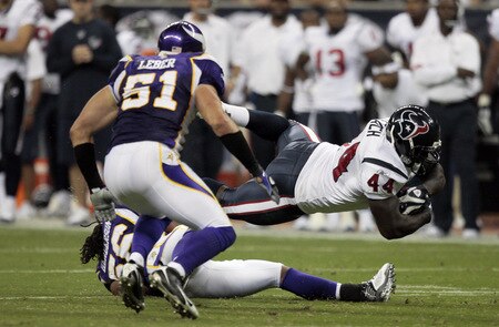 HOUSTON - AUGUST 31:  Running back  Vonta Leach #44 of the Houston Texans dives for extra yardage as he his tackled by linebacker E.J. Henderson #56 of the Minnesota Vikings as  linebacker Ben Leber #51 looks on August 31, 2009 in Houston, Texas.  <br /><br /><span class="help">(Photo by Bob Levey/Getty Images)</span>