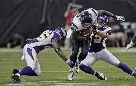 HOUSTON - AUGUST 31:  Running back Steve Slaton #20 of the Houston Texans runs through the tackle of linebackers  Chad Greenway #52 and E.J. Henderson #56 of the Minnesota Vikings at Reliant Stadium on August 31, 2009 in Houston, Texas.  <br /><br /><span class="help">(Photo by Bob Levey/Getty Images)</span>