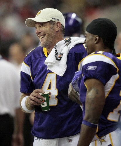 HOUSTON - AUGUST 31:  Quarterback Brett Favre #4 of the Minnesota Vikings shares a laugh wide receiver Jaymar Johnson #11 at Reliant Stadium on August 31, 2009 in Houston, Texas.  <br /><br /><span class="help">(Photo by Bob Levey/Getty Images)</span>