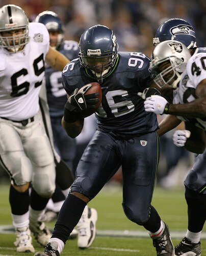 SEATTLE - SEPTEMBER 03:  Defensive tackle Michael Bennett #96 of the Seattle Seahawks rushes the ball after recovering a fumble against the Oakland Raiders on September 3, 2009 at Qwest Field in Seattle, Washington. <br /><br /><span class="help">(Photo by Otto Greule Jr/Getty Images)</span>
