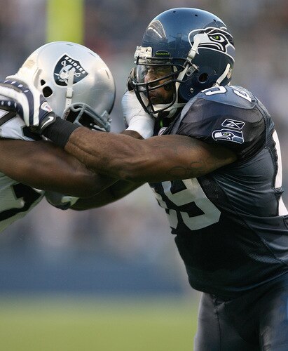 SEATTLE - SEPTEMBER 03:  Linebacker Aaron Curry #59 of the Seattle Seahawks battles tackle Cornell Green #74 of the Oakland Raiders on September 3, 2009 at Qwest Field in Seattle, Washington. The Seahawks defeated the Raiders 31-21. <br /><br /><span class="help">(Photo by Otto Greule Jr/Getty Images)</span>