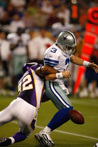 MINNEAPOLIS, MN - SEPTEMBER 4: Quarterback Jon Kitna #3 of the Dallas Cowboys fumbles the football as he is hit by defensive end Jayme Mitchell #92 of the Minnesota Vikings at Hubert H. Humphrey Metrodome on September 4, 2009 in Minneapolis, Minnesota. <br /><br /><span class="help">(Photo by Scott Boehm/Getty Images)</span>
