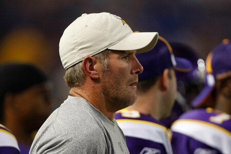 MINNEAPOLIS, MN - SEPTEMBER 4: Quarterback Brett Favre #4 of the Minnesota Vikings watches the game from the sidelines against the Dallas Cowboys at Hubert H. Humphrey Metrodome on September 4, 2009 in Minneapolis, Minnesota. <br /><br /><span class="help">(Photo by Scott Boehm/Getty Images)</span>