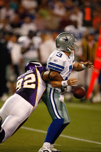 MINNEAPOLIS, MN - SEPTEMBER 4: Quarterback Jon Kitna #3 of the Dallas Cowboys fumbles the football as he is hit by defensive end Jayme Mitchell #92 of the Minnesota Vikings at Hubert H. Humphrey Metrodome on September 4, 2009 in Minneapolis, Minnesota. <br /><br /><span class="help">(Photo by Scott Boehm/Getty Images)</span>